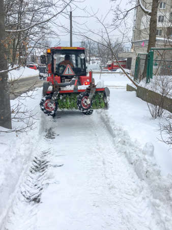 Lviv city, Ukraine, February 2021. Snowblower removes snow. Ukraine is covered with snow.のeditorial素材