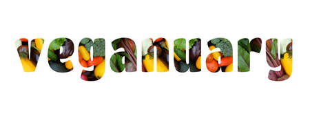 Banner. word Vegan on a white background isolated. Stencil on the background of various multi-colored vegetables. January vegan food concept.の写真素材