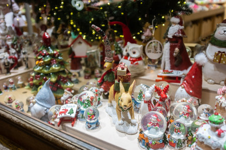 Santa Claus, glass snowball, Christmas decorations in a shop window in Lviv, Ukraine. Blur and...