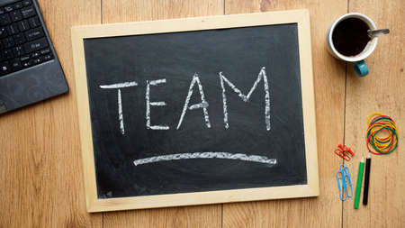TEam written on a chalkboard at the officeの写真素材