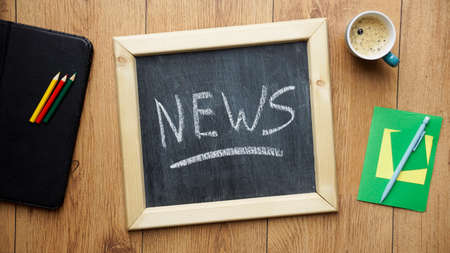 News written on a chalkboard at the officeの写真素材