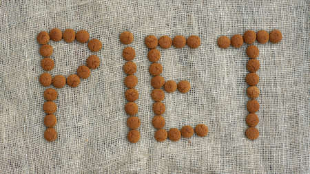 The text Piet is written with pepernoten, typical Dutch treat for Sinterklaas on 5 decemberの写真素材