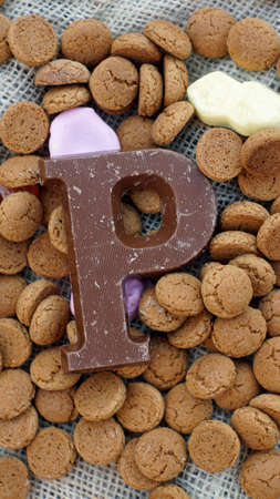 Pile of Dutch Pepernoten and chocolate, typical Dutch treat for Sinterklaas on 5 decemberの写真素材