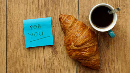 A breakfast on the table and a memo with for you writtenの写真素材