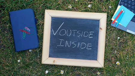 Working inside or outside in a parkの写真素材