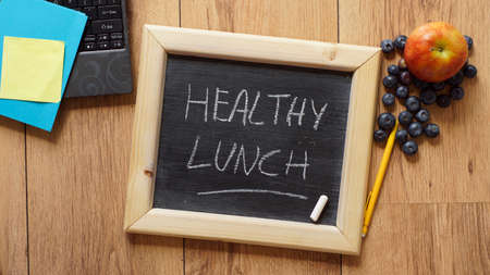 Healthy lunch written on a chalkboard at the officeの写真素材