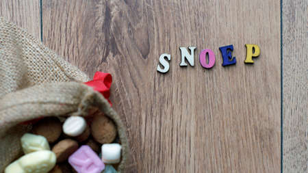 Ginger nuts and the word candy in Dutch written for the Dutch Santa-Claus celebration for the 5th of Decemberの写真素材