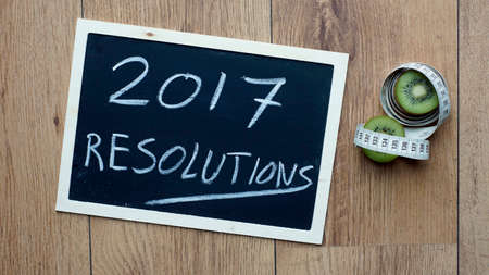 Resolutions in 2017 written next to kiwi fruit and a centimeterの写真素材
