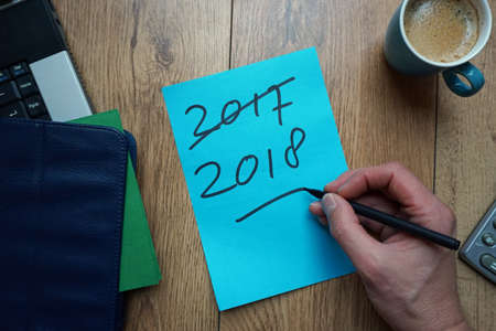 2018 written on a memo at the office 2017 is crossed                             