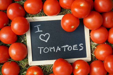 I love tomatoes written on a chalkboardの写真素材