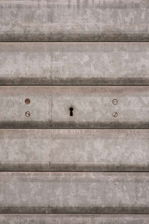 Metallic Shutters with Keyhole  Metallic Background Texture の写真素材