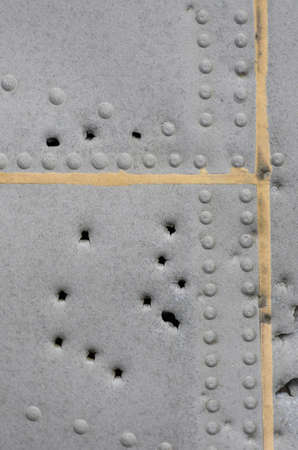 Damaged Metallic Background Texture with holesの写真素材