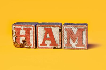 "Ham" spelled out with old toy blocks.の写真素材