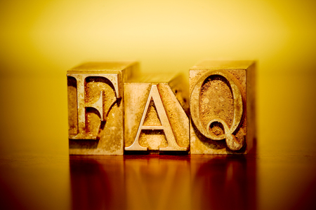 The phrase "FAQ" composed out of printer's blocks.の写真素材