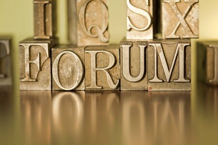 The word forum spelled out with letterpress blocks.の写真素材