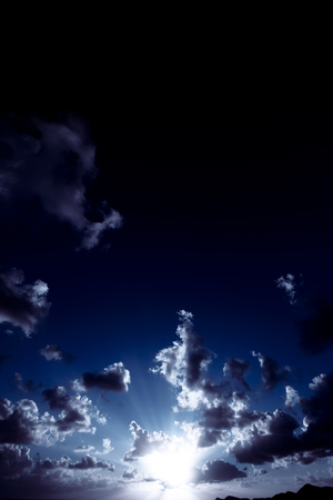 High-Contrast image of a sunset and clouds.の写真素材