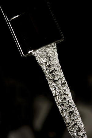 macro shot of pouring waterの写真素材