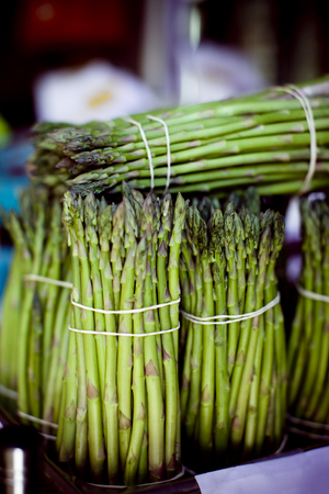Bunches of Organic Asparagus at local Farmer's Market. Shallow DOF.の写真素材