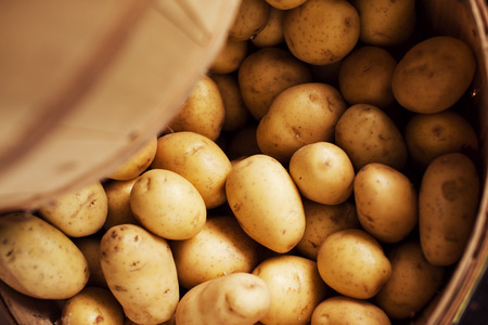 Close up of potatoes in barrelの写真素材
