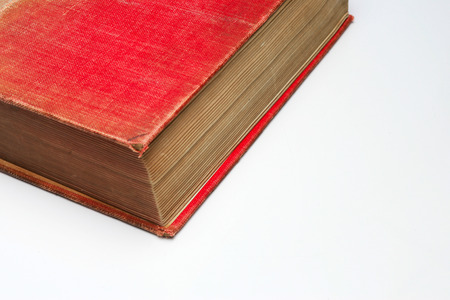 Detail of old red book on white backgroundの写真素材