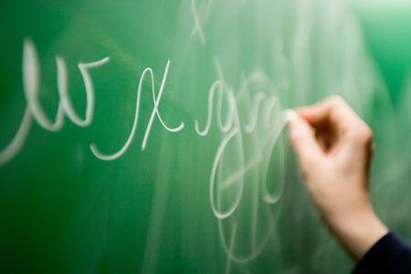 Writing on chalkboard. の写真素材