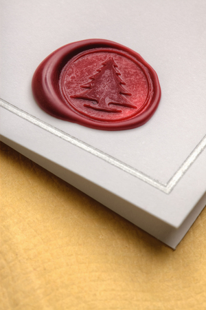 Wax Christmas Tree seal on greeting card.の写真素材