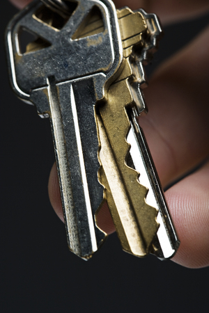 Three keys in handの写真素材