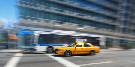 Bus and Cab driving in NYCの写真素材
