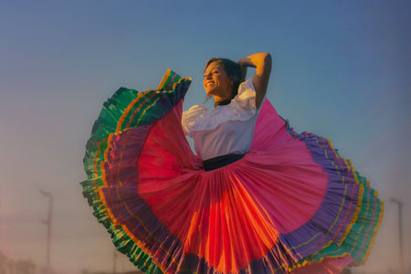Happy Costa Rican woman dancing in the streets wearing a colorful shirt and a white decorative shirtの素材