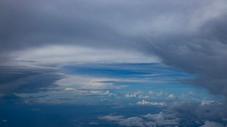 Dramatic cloudscape panorama wiht various type of cloud formations and copy space, photographed from mid air.の写真素材
