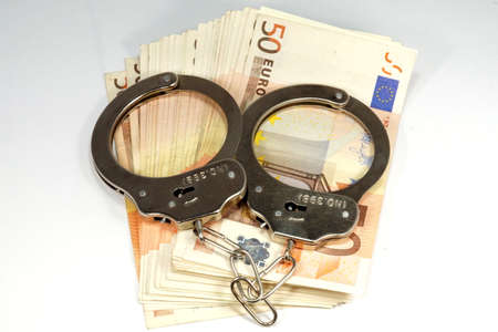 Handcuffs moneyの写真素材