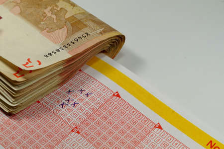 Lottery ticket and money