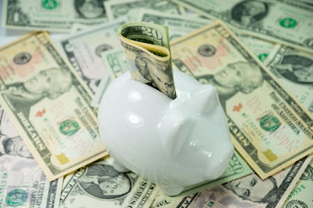 A piggy bank and cashの写真素材
