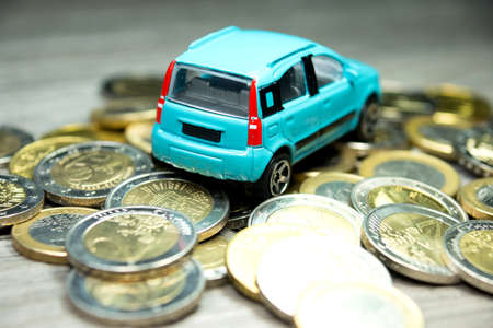 Euro coins and a carの写真素材