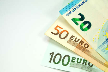 Euro banknotes on a white backgroundの写真素材