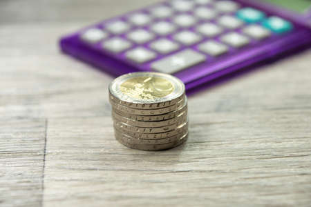 Euro coins and calculator