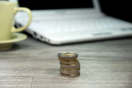 Coins on a office tableの写真素材
