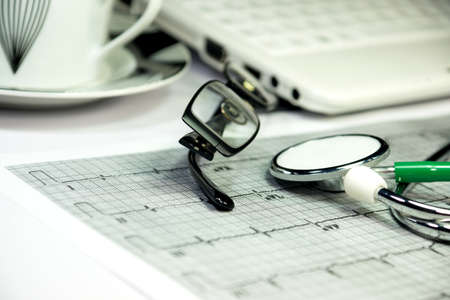 A stethoscope and on electrocardiogramの写真素材