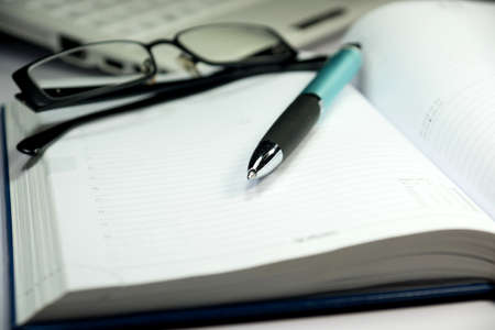 An integrated scheduler on an office tableの写真素材