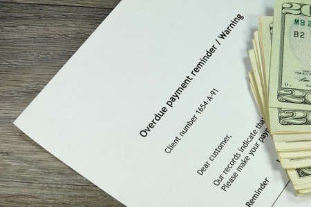 Overdue notice and moneyの写真素材