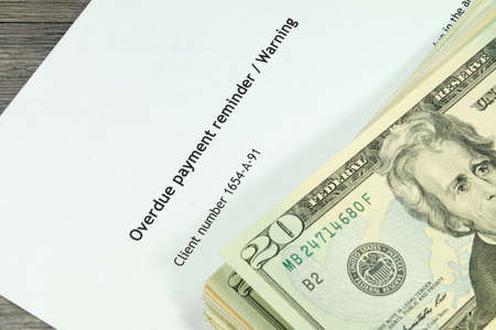 Overdue notice and moneyの写真素材