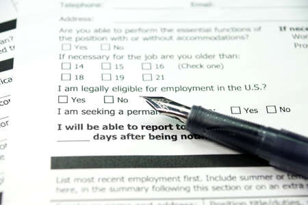 Employment application and a penの写真素材