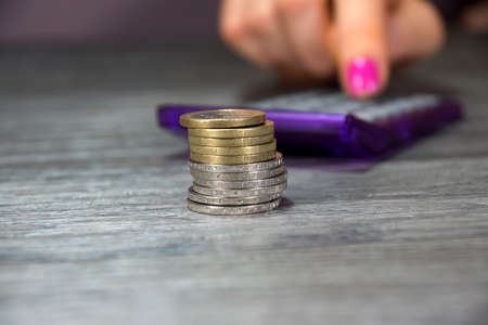 woman's hand with calculatorの写真素材