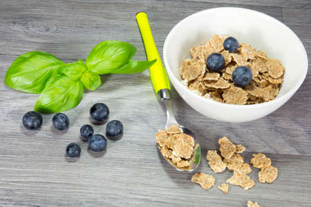 bowl of muesli with spoonの写真素材