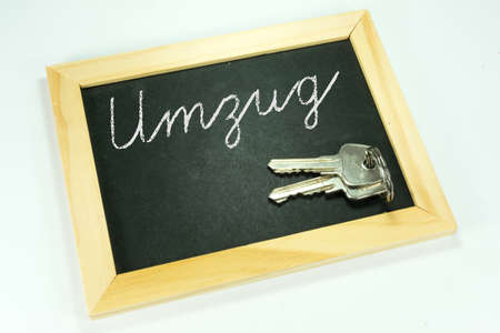 A chalkboard with the text move and a keyの写真素材