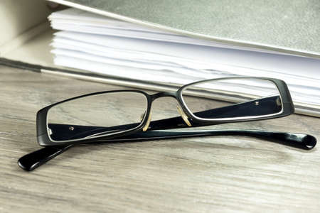 Documents folder and glassesの写真素材