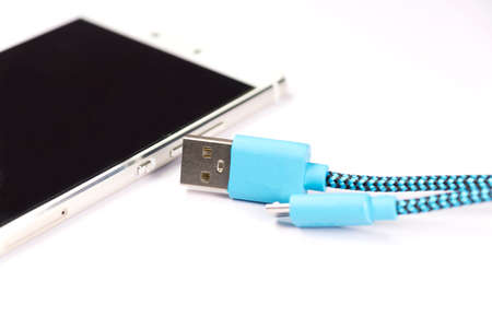 USB cable and a smartphoneの写真素材
