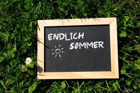 A blackboard with the text last summerの写真素材