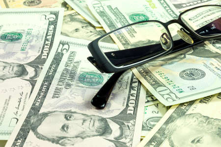 Money and glassesの写真素材
