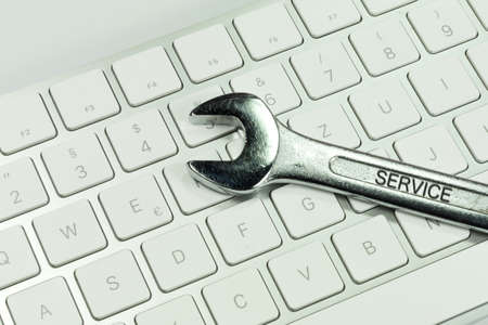 Computer and a combination wrenchの写真素材